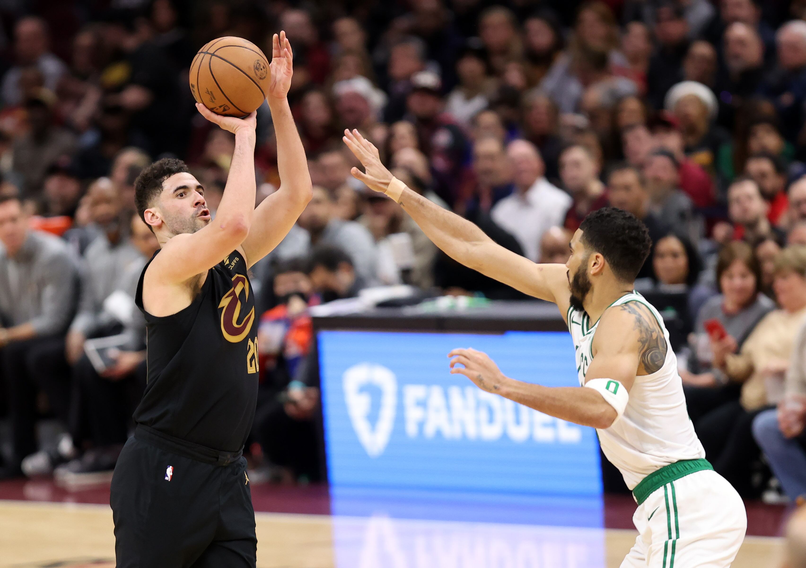 Cleveland Cavaliers forward Georges Niang shoots over Boston Celtics forward Jayson Tatum in the second half of play. 