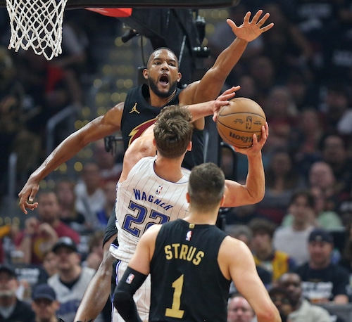 Cleveland Cavaliers forward Evan Mobley defends the paint against Orlando Magic forward Franz Wagner in the first half of play.