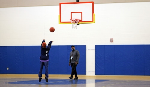 Juveniles play basketball in the detention center during a tour of the Cuyahoga county juvenile justice center, which includes the courts and detention center.
