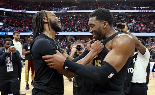 Cleveland Cavaliers guard Darius Garland and Cleveland Cavaliers guard Donovan Mitchell celebrate their win over the Orlando Magic to advance to the Eastern Conference semifinals.