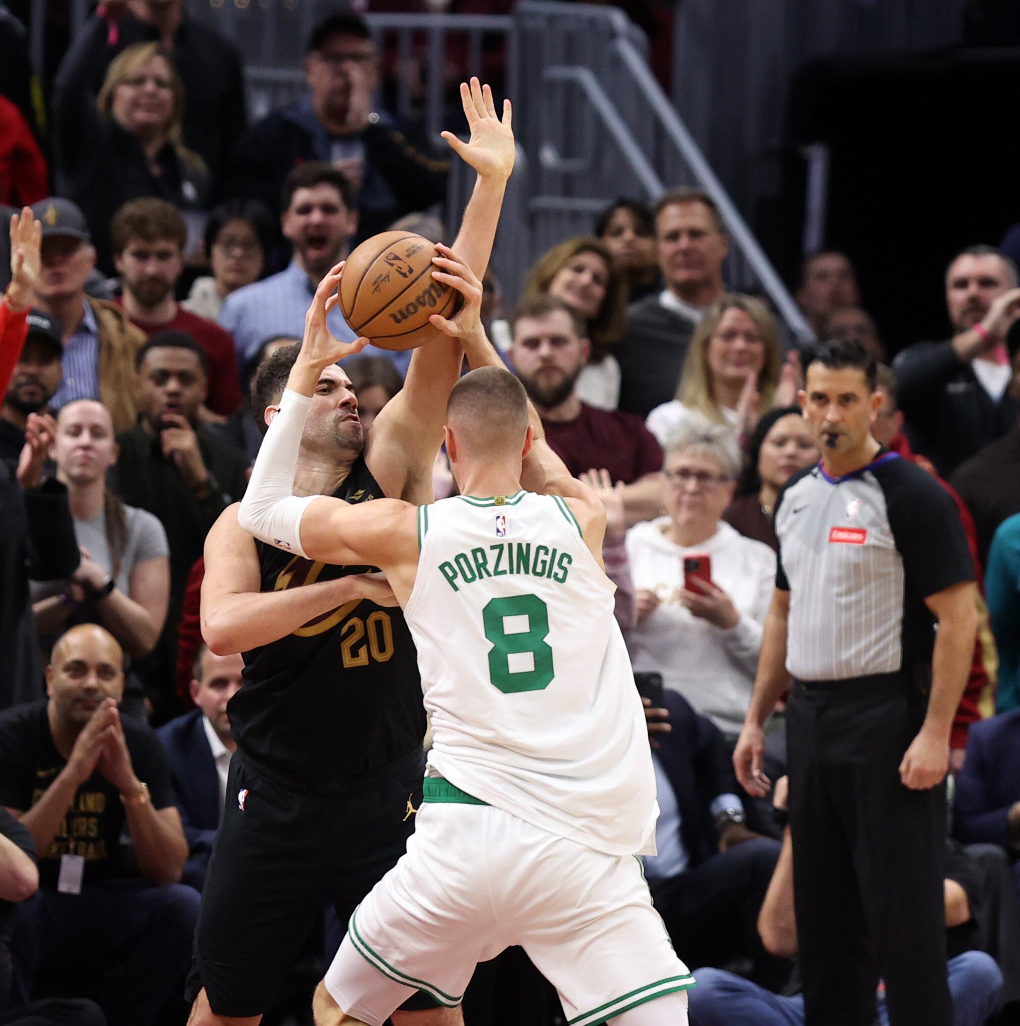 Cleveland Cavaliers forward Georges Niang defends against Boston Celtics center Kristaps Porzingis in the second half of play. 