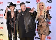 Country star Jelly Roll and his wife, Bunnie Xo, right, seen with country singer Lainey Wilson, began this week in triumph with Jelly Roll successfully completeing a 5K run, part of a new healthier lifestyle. But it closed in tragedy with Bunnie XO announcing her father had succumbed to cancer.