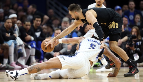 Cleveland Cavaliers guard Max Strus steals the ball away from Orlando Magic forward Paolo Banchero in the first half of play.