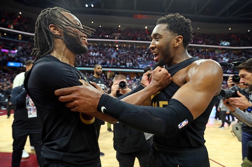 Cleveland Cavaliers guard Darius Garland and Cleveland Cavaliers guard Donovan Mitchell celebrate their win over the Orlando Magic to advance to the Eastern Conference semifinals.